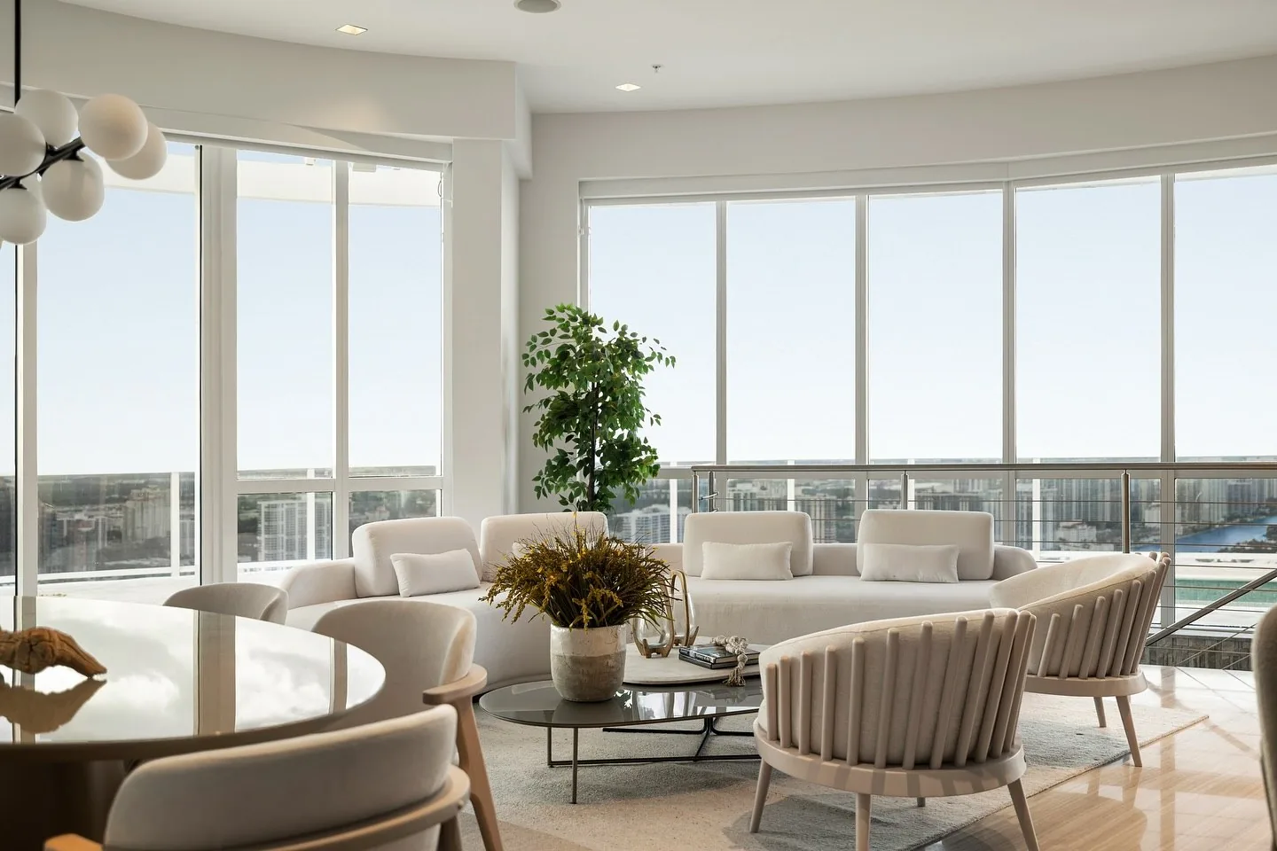 Waterfront living room with balcony and city view