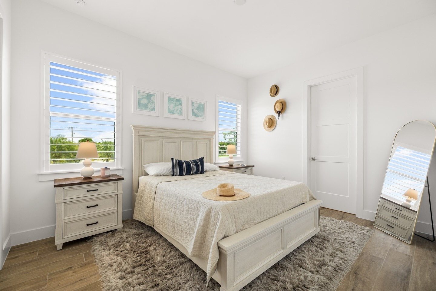 Bright guest bedroom with plantation shutters