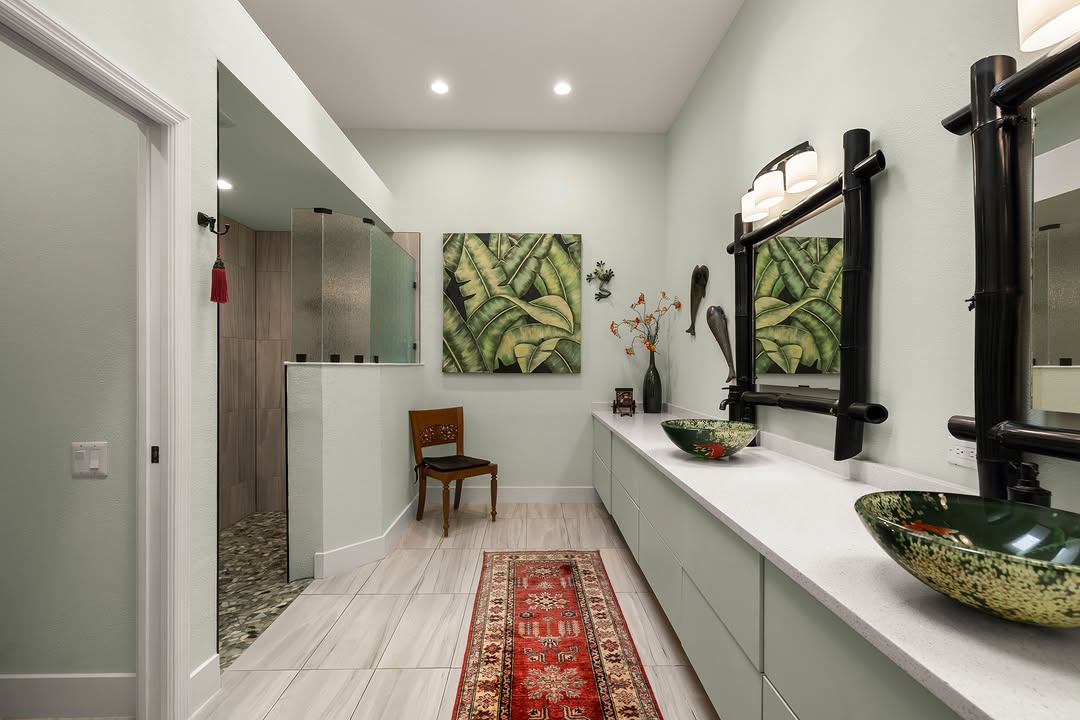Long spa bathroom with twin vanities and patterned runner