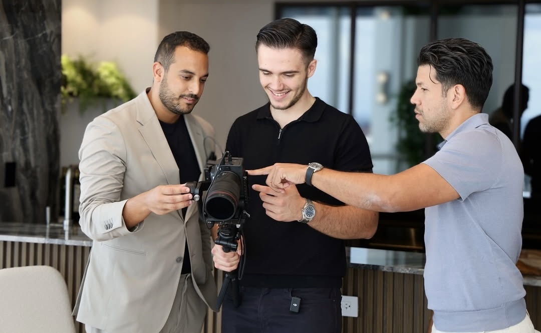 Samir reviewing an architectural photo with a client on location