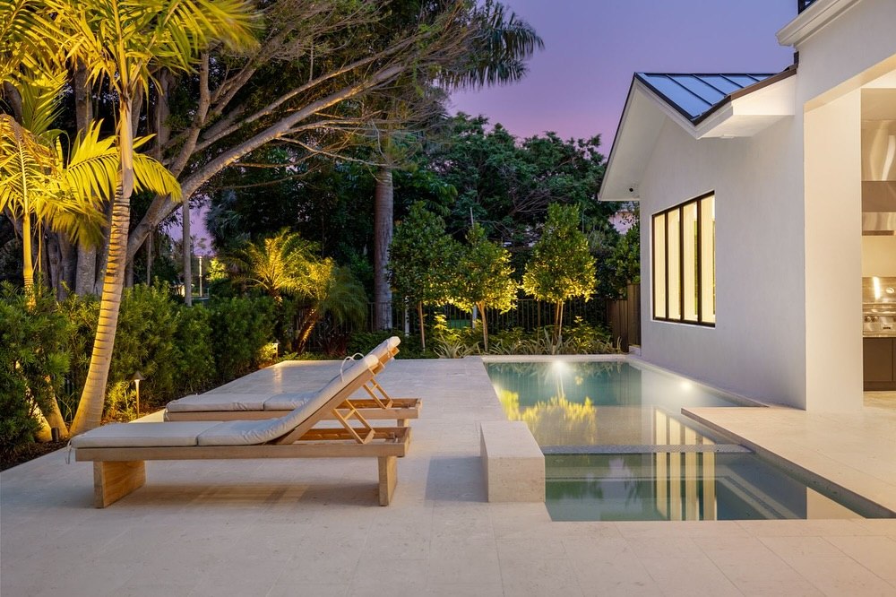 Modern Florida pool and exterior photographed at twilight
